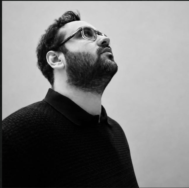 Black-and-white portrait of Ekin Kaplan
